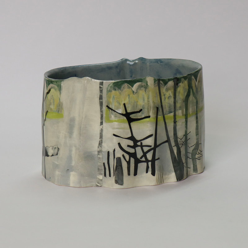 corrugated ceramic cylinder painted to depict trees cut by beavers
