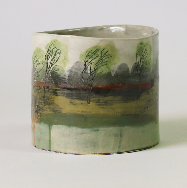 small handbuilt ceramic cylinder depictingwillows grown for cricket bats, and flood