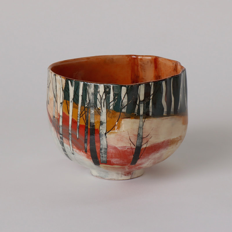 handbuilt ceramic bowl slip painted to depict winter birch woodland