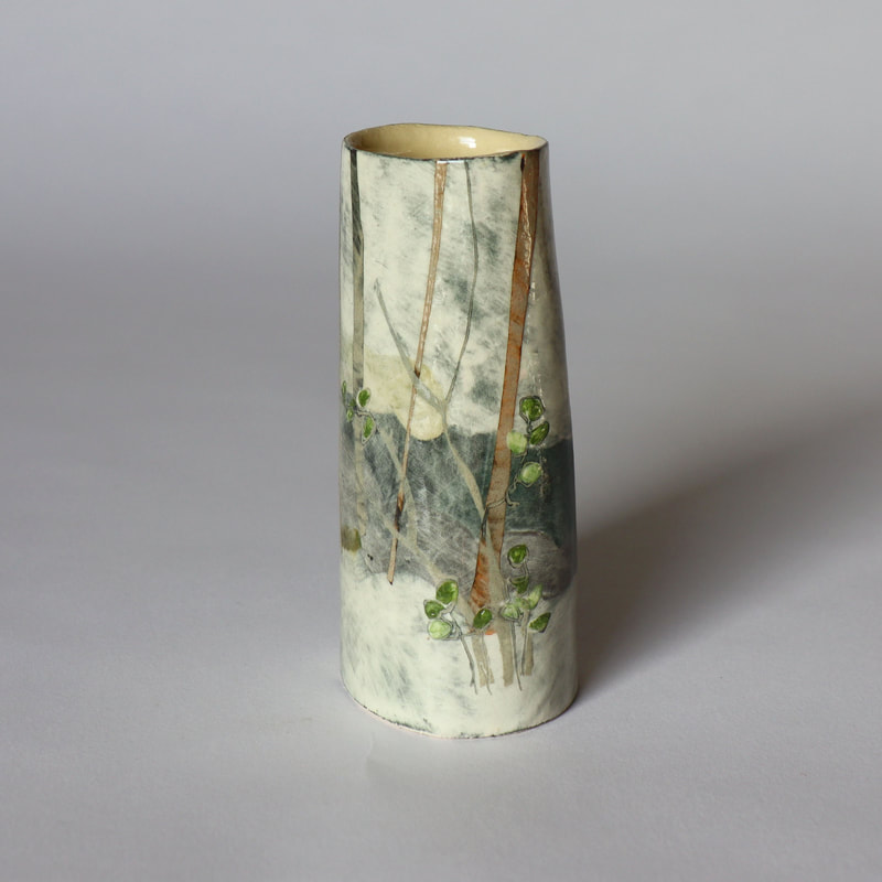 small ceramic bottle painted to depict hazel saplings