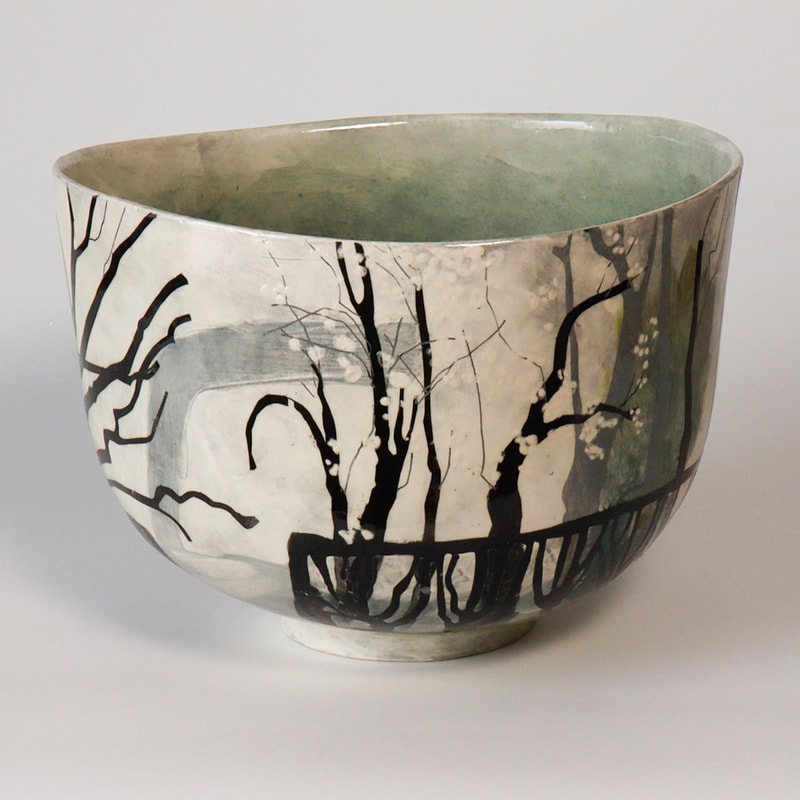large ceramic bowl, painted blacktrees and white blossom