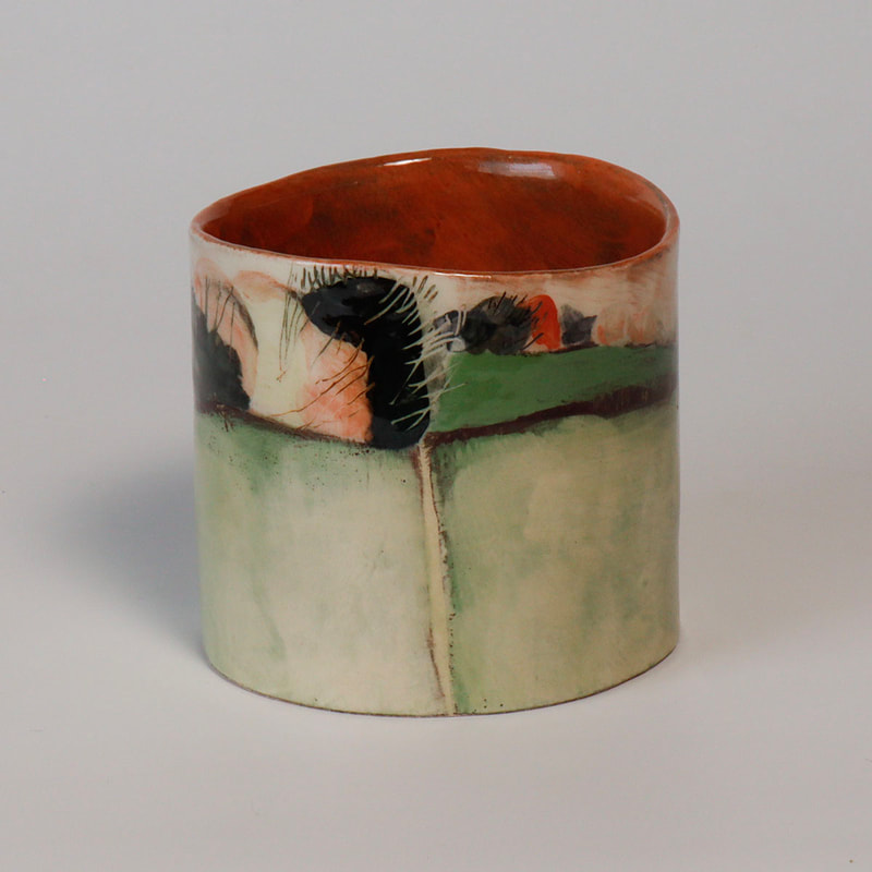 small handbuilt cylinder bowl depicting fields and hedges