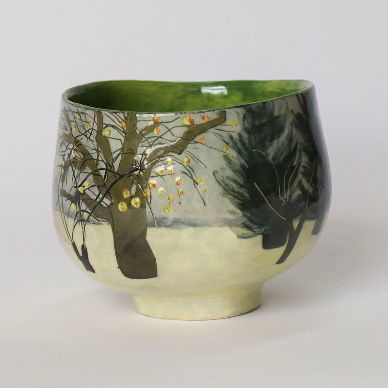 concave ceramic bowl depicting orchard